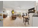 Bright living room showcasing neutral decor, ceiling fan, and an open concept design at 1597 Cambridge Lakes Dr # 303E, Mount Pleasant, SC 29464