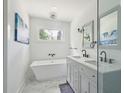 Elegant bathroom with a soaking tub, double vanity, and modern fixtures at 1756 Mchenry Ave, Charleston, SC 29412