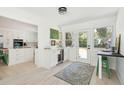 Open-concept kitchen with a wine fridge and convenient access to the outdoor area at 1756 Mchenry Ave, Charleston, SC 29412