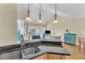 View of kitchen from the sink looking into the living room with open floor plan at 1984 Folly Rd # A306, Charleston, SC 29412