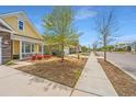 Street view showcasing the home's curb appeal and landscaping in a well-maintained community at 2010 Redback Dr, Summerville, SC 29483