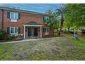 Attractive brick townhomes with black doors, landscaped grounds, and well-maintained exteriors at 21 Hester St # Apt 12, Charleston, SC 29403