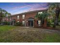 Beautiful brick townhomes with manicured lawn and inviting entrances create a welcoming atmosphere at 21 Hester St # Apt 12, Charleston, SC 29403