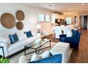 Comfortable living room with sofa, chairs, decorative pillows, and an open floor plan at 214 Garden Gate Way, Summerville, SC 29486