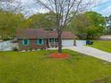Aerial view of brick home with a spacious yard and driveway at 2233 Glendale Dr, Charleston, SC 29414