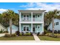 Charming two-story home with inviting double porches and beautifully landscaped front yard at 2632 Private Lefler Dr, Johns Island, SC 29455