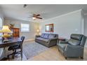 Comfortable living room with a ceiling fan, desk, and leather furniture at 322 Lantana Dr, Charleston, SC 29407