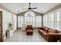 Bright sunroom with large windows, tile flooring, and comfortable seating at 3558 Stockton Dr, Mount Pleasant, SC 29466