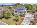 Expansive aerial view of the home with a long driveway, mature trees and landscaped lawn at 3734 St Ellens Dr, Mount Pleasant, SC 29466