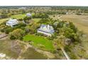 Beautiful aerial view of home and other homes near the marsh with a wooden walkway at 377 Lofton Ct, McClellanville, SC 29458
