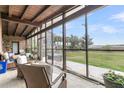 Relaxing screened porch with comfortable seating and panoramic views of the outdoor scenery at 4701 Apple St, North Charleston, SC 29405