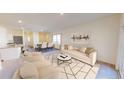 Bright living space with a neutral color palette, contemporary furnishings, an adjacent dining area, and seamless flow to the kitchen at 527 Pender Woods Dr, Summerville, SC 29486