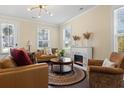 Bright living room featuring a fireplace, hardwood floors, and natural lighting at 547 Pontoon Rd, Huger, SC 29450