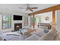 Cozy living room featuring a fireplace, a comfortable sofa, and an open dining area at 753 Lake Frances Dr, Charleston, SC 29412