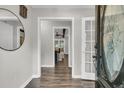 Inviting entryway featuring a glass paneled door, hardwood floors, and views into the adjacent living spaces at 811 E Estates Blvd, Charleston, SC 29414