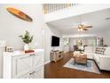 Bright, open living room featuring hardwood floors, modern furnishings, and stylish decor at 9118 Maple Grove Dr, Summerville, SC 29485