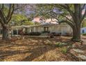 Attractive single-story home showcasing professional landscaping and mature trees at 935 Lansing Dr, Mount Pleasant, SC 29464