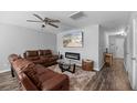 Comfortable living room featuring a modern fireplace and ceiling fan, perfect for relaxing at 9727 Transplanter Cir, Ladson, SC 29456