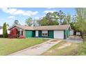 Inviting single-story home with a mix of brick and siding, a neat front lawn, and an attached one-car garage at 1003 Mountain Pine Rd, Moncks Corner, SC 29461