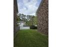 Spacious backyard featuring lush green grass and a privacy fence at 108 Sandlewood Dr, Summerville, SC 29483