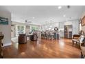 Open-concept living area featuring hardwood floors and a kitchen with stainless steel appliances at 1111 Kilarney Rd, Mount Pleasant, SC 29464