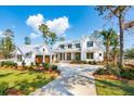 Stunning exterior of home with matching garage and a paved driveway at 116 Peninsula Dr, Ravenel, SC 29470