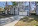 Charming home with a double-door garage and a long driveway at 117 Lewisfield Dr, North Charleston, SC 29418