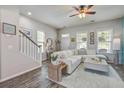 Bright and airy living room featuring a comfortable sofa and stylish decor with lots of natural light at 123 Hyacinth St, Summerville, SC 29483