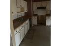 Outdated kitchen features classic white cabinets and tiled backsplash, ready for a modern refresh at 143 Mickler Dr, Ladson, SC 29456