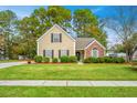 Well-maintained home with manicured lawn and landscaping, showcasing classic suburban charm and curb appeal at 177 Thousand Oaks Cir, Goose Creek, SC 29445