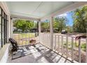 View from front porch featuring a seating area overlooking the tree lined yard at 1778 Brockington Ave, Charleston, SC 29407