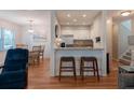 Open-concept living area featuring hardwood floors, stylish furniture, and a view into the modern kitchen at 2 Pelican Reach # Share 11, Isle of Palms, SC 29451