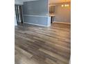 Spacious living room featuring wood-look flooring and gray accent walls at 203 Oakmont Ave # B, Ladson, SC 29456