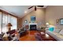 Bright living room featuring vaulted ceiling, hardwood floors and fireplace at 2071 Middleburg Ln, Mount Pleasant, SC 29464