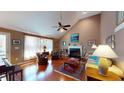 Inviting living room with vaulted ceiling, hardwood floors, and a cozy fireplace at 2071 Middleburg Ln, Mount Pleasant, SC 29464