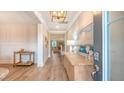Bright entryway featuring beautiful hardwood floors, elegant lighting, and decorative accents at 210 Bilge Rd, Ridgeville, SC 29472