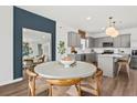 Charming dining room featuring modern finishes adjacent to a kitchen with stainless steel appliances at 213 West Bradford Pointe Dr, Summerville, SC 29486