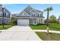 Classic two-story home with a manicured lawn, attached garage, and traditional architectural details at 215 Center Hill Ct, Summerville, SC 29485