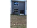 The house's backyard has sliding glass doors that let in natural light at 2402 Scarlett Maple St, Summerville, SC 29486