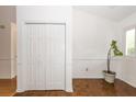 Bright foyer with white walls, closet with folding doors, and wood floors that add warmth at 2441 Hansard Dr, North Charleston, SC 29406
