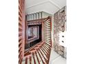 Beautiful staircase with brick accent wall at 3 Queen St # 315, Charleston, SC 29401