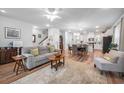 Open-concept living and dining area with modern decor, hardwood floors, and ample natural light at 307 Lanyard St, Johns Island, SC 29455