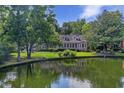 Charming home surrounded by mature trees and a tranquil lake at 3168 Stanyarne Dr, Charleston, SC 29414