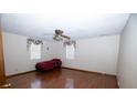 A simple bedroom featuring hardwood floors, a ceiling fan and mini-blinds at 389 Maggie Rd, Mount Pleasant, SC 29464