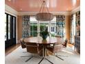 Cozy dining room with round table, designer light fixture, and verdant decorative accents at 478 Huger St, Charleston, SC 29403