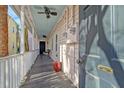 Inviting covered porch with a ceiling fan and seating area at 5 Kracke St # A, Charleston, SC 29403