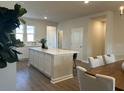 A kitchen featuring an island, white cabinets, and a view into the dining room at 5108 Double Eagle Lp, Summerville, SC 29485