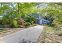 Two-story home showcasing a driveway and landscaping at 683 Edmonds Dr, Charleston, SC 29412