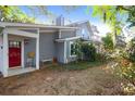 Charming home with inviting front porch with red front door at 683 Edmonds Dr, Charleston, SC 29412
