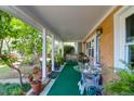 Relaxing side porch adorned with plants, creating a serene outdoor space at 683 Edmonds Dr, Charleston, SC 29412